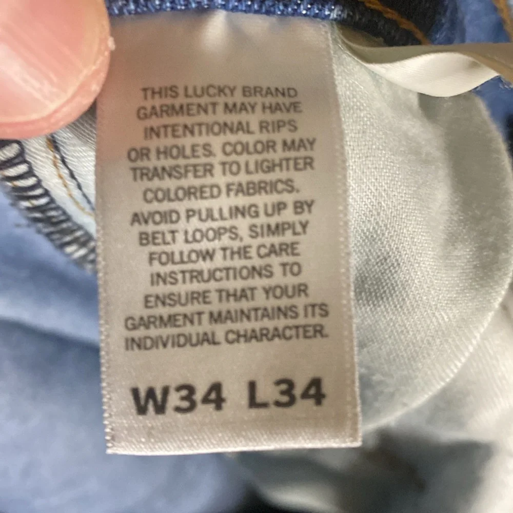 Lucky Brand 410 Athletic Slim jeans size 34x34 cuffs slit for boots